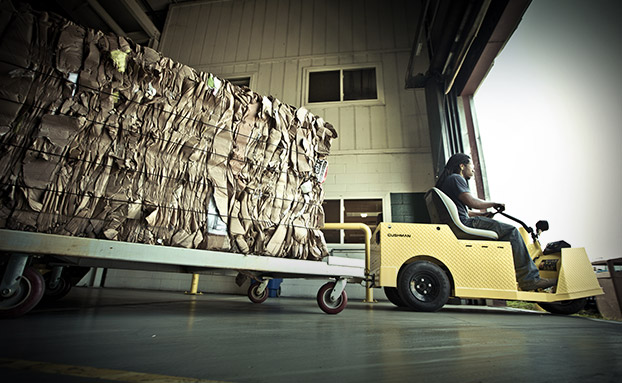 Person operating a Cushman utility vehicle