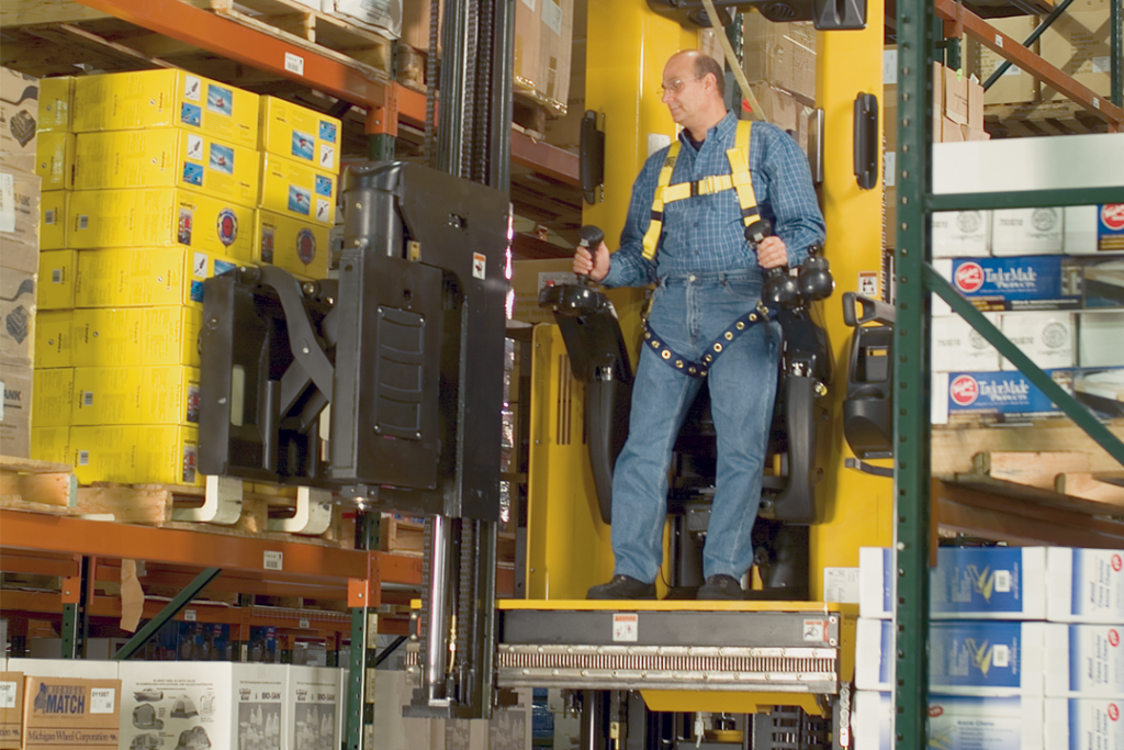 Person operating a narrow aisle forklift