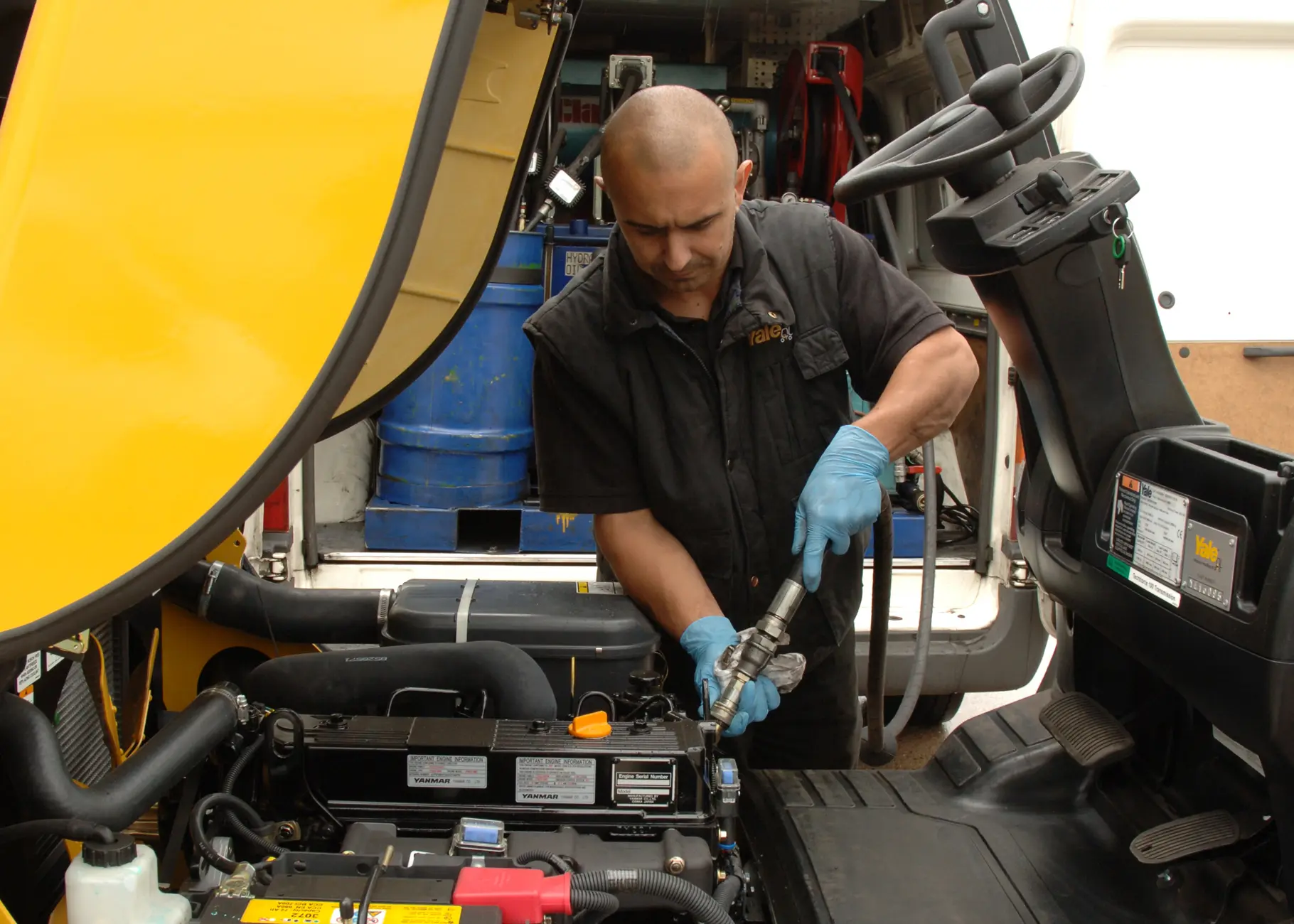 Person servicing a Yale forklift