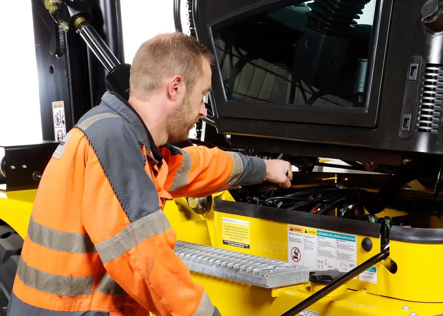 Person servicing a Yale forklift